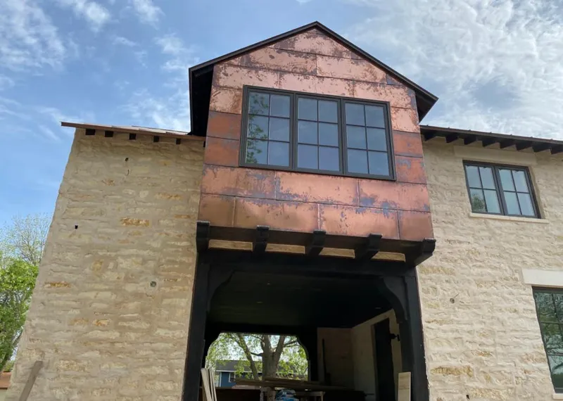 Copper metal panel facade on a stone building for Skylight Installation in Daytona Beach Shores