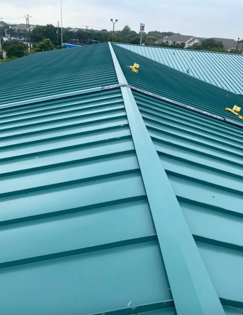 Green commercial metal roof ridge and valley for Metal Roof Repair in Daytona Beach Shores